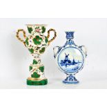 Delft pottery moon flask, painted with a canal and windmill to one side and flowers to the other,