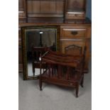 A 20th century wall mirror with a faux burr wood frame with a beveled glass plate together with a