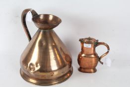 An unusual 19th century copper jug of slender proportions with a heart decorated to the end of the