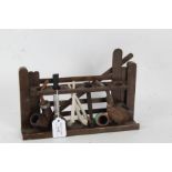 Novelty oak pipe rack, in the form of a gate, with a collection of pipes, the rack 28cm wide
