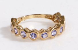 A 9 carat gold and tanzanite ring, the ring set with eleven brilliant cut tanzanite stones, ring