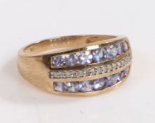 A 9 carat gold diamond ring, the head set with row of diamonds and two rows of light blue glass