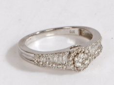 A 9 carat white gold and diamond ring, the head set with many diamonds in the form of a flower