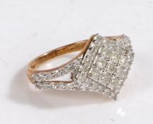 A 9 carat gold and diamond cluster ring, the head set with many diamonds in the form of a diamond