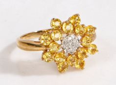 A 9 carat gold, diamond and yellow sapphire cluster ring, the head set with illusion set diamonds
