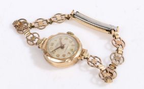 A 9 carat gold cases Lanco ladies wristwatch, the white dial with Arabic numerals and a subsidiary