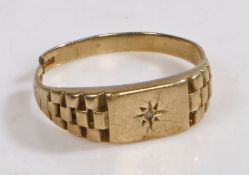 A 9 carat gold and diamond ring, the head set with a diamond with a star design surrounding, (Band
