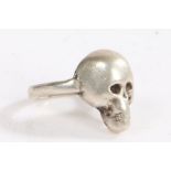 A silver skull ring, the head in the form of a skull, ring size S weight 12.1 grams