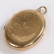 A 9 carat gold locket of oval form the front decorated with a floral design, weight 3.5 grams