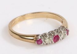 A 9 carat gold, ruby and diamond ring, the head set with three rubies intersected by two diamonds,