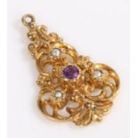 A 9 carat gold art nouveau pendant, set with a central amethyst and three pearls, weight 3.1 grams