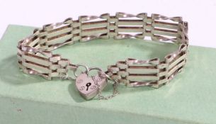 A silver gate link bracelet with a silver heart shaped clasp, weight  0.5oz