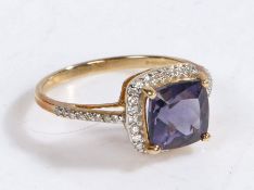 A 9 carat gold, diamond and blueberry quartz ring, the head set with claw mounted cushion cut