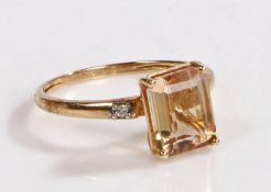 A 9 carat gold, diamond and ametrine ring, the head set with claw mounted baguette cut ametrine