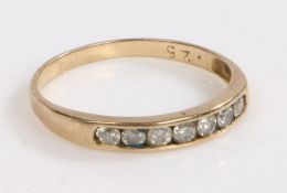 A Gold and diamond ring, the head set with seven diamonds gold marks partially rubbed, ring size L