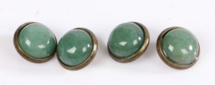 A set of four round yellow metal buttons with jade cabochons. Approx. diameter of cabochon 12mm.