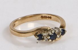 A 9 carat gold, sapphire and diamond ring, the head set with three sapphires and four diamonds, ring