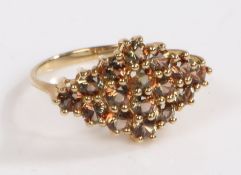 A 9 carat gold and andalusite cluster ring, the head set with sixteen andalusite stone in the form