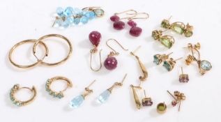 A good collection of fourteen pairs if 9 carat gold earrings to include hoop examples and others set