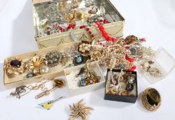 A collection of costume jewellery to include pearl necklaces, brooches and earrings etc housed