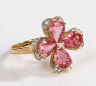 A 9 carat gold, diamond and pink tourmaline ring, the head in the form of a flower set with diamonds