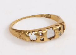 A yellow metal ring, marked partially rubbed, stones missing bar one diamond, ring size M weight 1.8