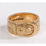 A 9 carat gold ring in the form of a belt decorated with floral scenes, ring size P weight 9.2 grams