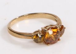 A 9 carat gold and ambilobe sphene ring, the head set with three claw mounted round cut ambilobe