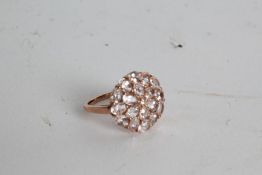 A 9 carat rose gold and pink morganite cluster ring, the head set with nineteen pink morganite