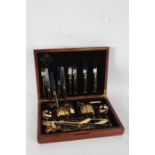 Canteen of Delphi gold plated table cutlery, with shell decorated handles, place settings for six,