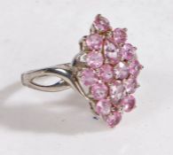 A 9 carat white gold and pink sapphire ring, the head set with sixteen pink sapphires, ring size N
