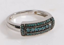 A 9 carat white gold and blue diamond ring, the head set with three main rows of blue diamonds, ring