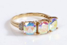 A 9 carat gold diamond ring, the head set with three Opalescence stones and diamonds to the