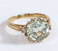 A 9 carat gold green amethyst and white topaz ring, the head set with a claw mounted green