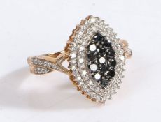 A yellow metal and diamond cluster ring, the head set with white and blue diamonds in the form of
