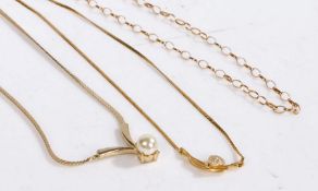 Three yellow metal necklaces, one set with paste another set with a pearl etc, gross weight 16.6