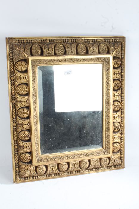 20th century rectangular gilt mirror, with a acanthus leaf and pinecone decoration together with a