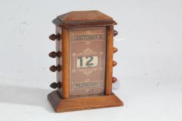 Victorian perpetual desk calendar, with rotating apertures for the day, date and month, 9.5cm