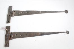 Near pair of substantial iron door hinges, 60 and 64cm wide