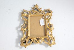 Rococo style gilt metal frame, with pierced scrolling border, 28cm tall