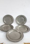 Five 19th Century pewter chargers, two 38cm diameter and three 42cm diameter