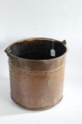 Victorian copper coal bucket, having brass swing handle and riveted cylindrical body, 34cm diameter