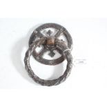 Tudor style iron door knocker, the pierced roundel backplate with rope twist effect ring, 13cm wide,