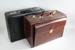 Two 20th century combination leather briefcases, one in black the other brown (2)