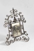 20th century wrought iron easel photograph frame, of arched scrolling form, 26cm tall