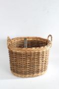 Wicker twin handled oval log basket, 45cm wide, 41cm high, together with a coal shovel (2)