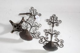 Pair of iron Cruisie oil lamps with scrolled backs, together with a open pan quadruple hanging oil