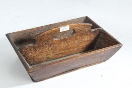 George III oak two division cutlery tray, having shaped carrying handle, 35cm wide