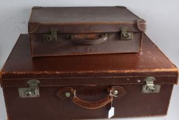 Brown leather suitcase by "Smiths Bag Manufacturers Suitall Ipswich", the exterior initialled J.B.L.