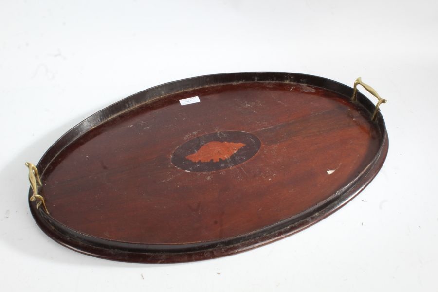 19th century mahogany tray, of oval form, with brass carrying handles and centred with a shell
